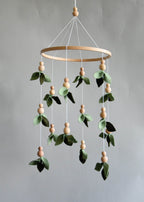 Forest style floral mobile with leaves and wooden pearls - Minidreams Decor