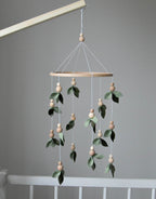Forest style floral mobile with leaves and wooden pearls - Minidreams Decor