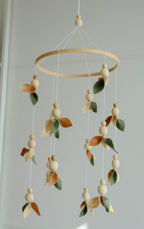 Floral mobile with wooden pearls, green, beige, brown and leaves - Minidreams Decor
